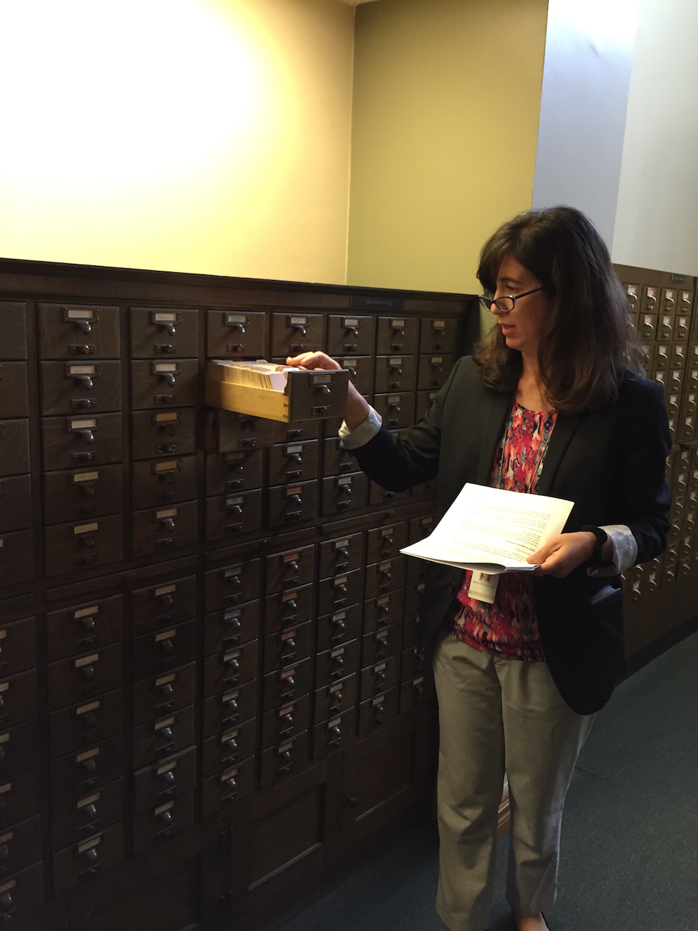 Our Tour Guide & Reader Services Librarian Anne Blecksmith, showing off the card catalog.