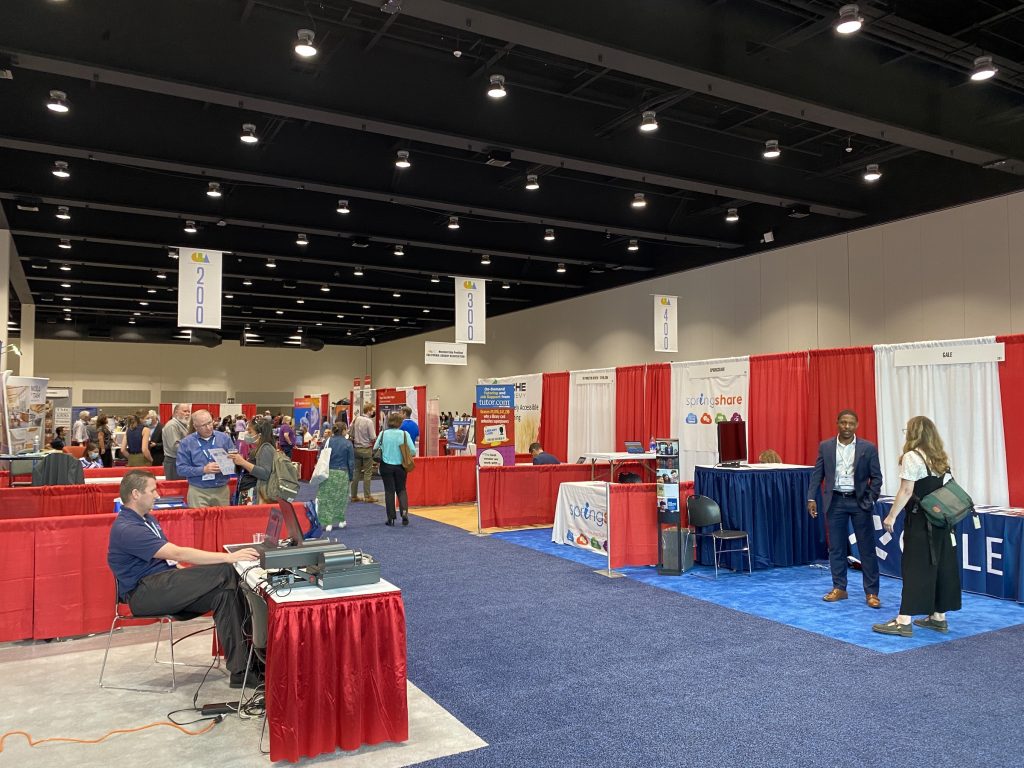 The Exhibit Hall at CLA with booths and exhibitors lining either side