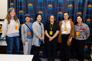 Kristi Kenney with several SJSU student volunteers at the library’s reopening.