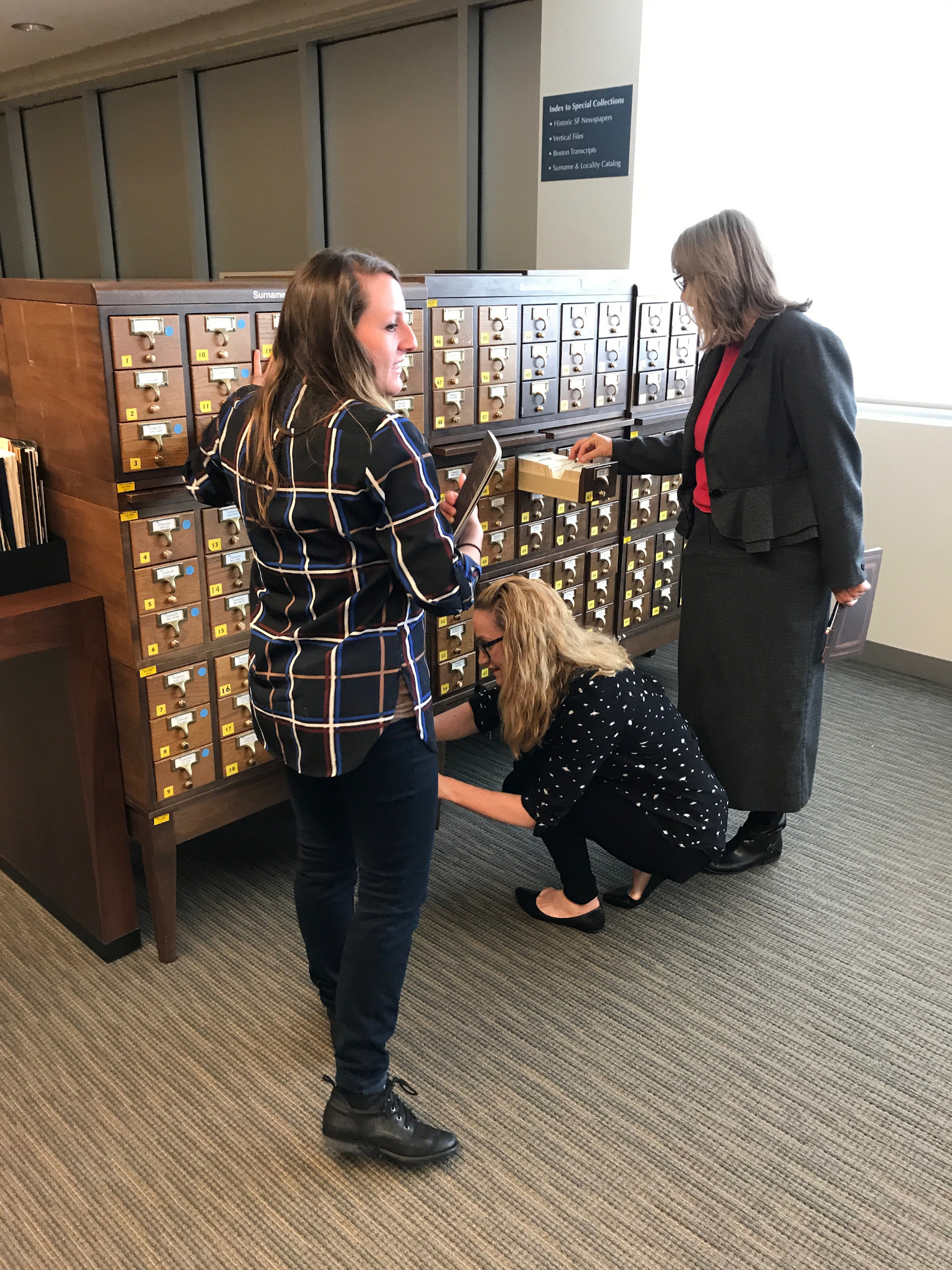 Students looking at the surname card catalog