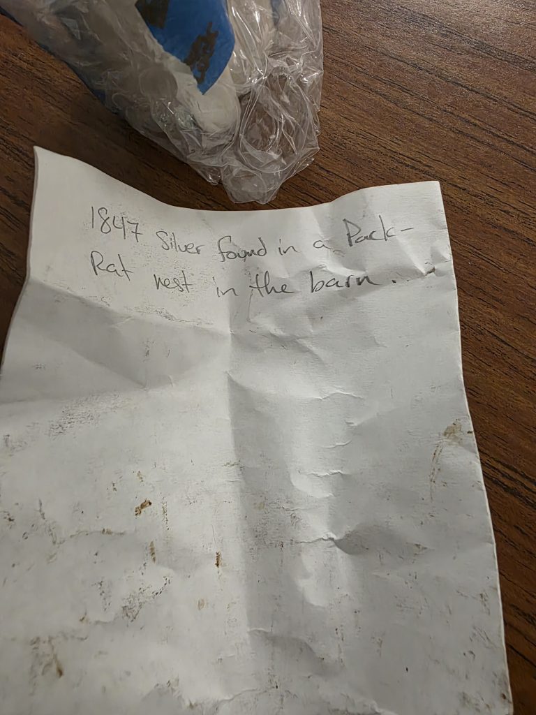 A wrinkled paper with a note about the silverware.