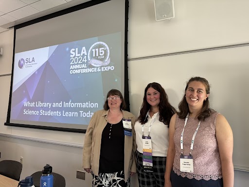 Photo: Standing with the presenting SLA Student panel.